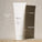 The image displays a tube of Tropic Body Love Firming Buttercream standing against a textured wall with sunlight casting a soft shadow. Key features of the product are labeled:
Zingy citrus scent, providing a refreshing, uplifting aroma.
Toning, aimed at improving skin firmness and elasticity.
Hydrating, formulated with nourishing ingredients like shea butter, pink peppercorn, and vitamin E to deeply moisturize the skin.